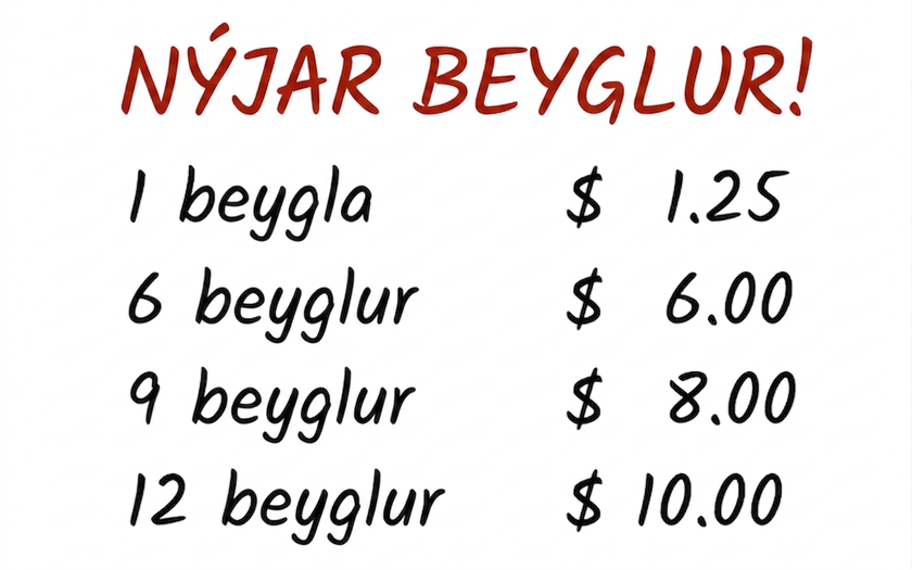 Skilti með verði á ferskum beyglum: 1 beygla kostar 1,25 dollara, 6 beyglur kosta 6 dollara, 9 beyglur kosta 8 dollara og 12 beyglur kosta 10 dollara.